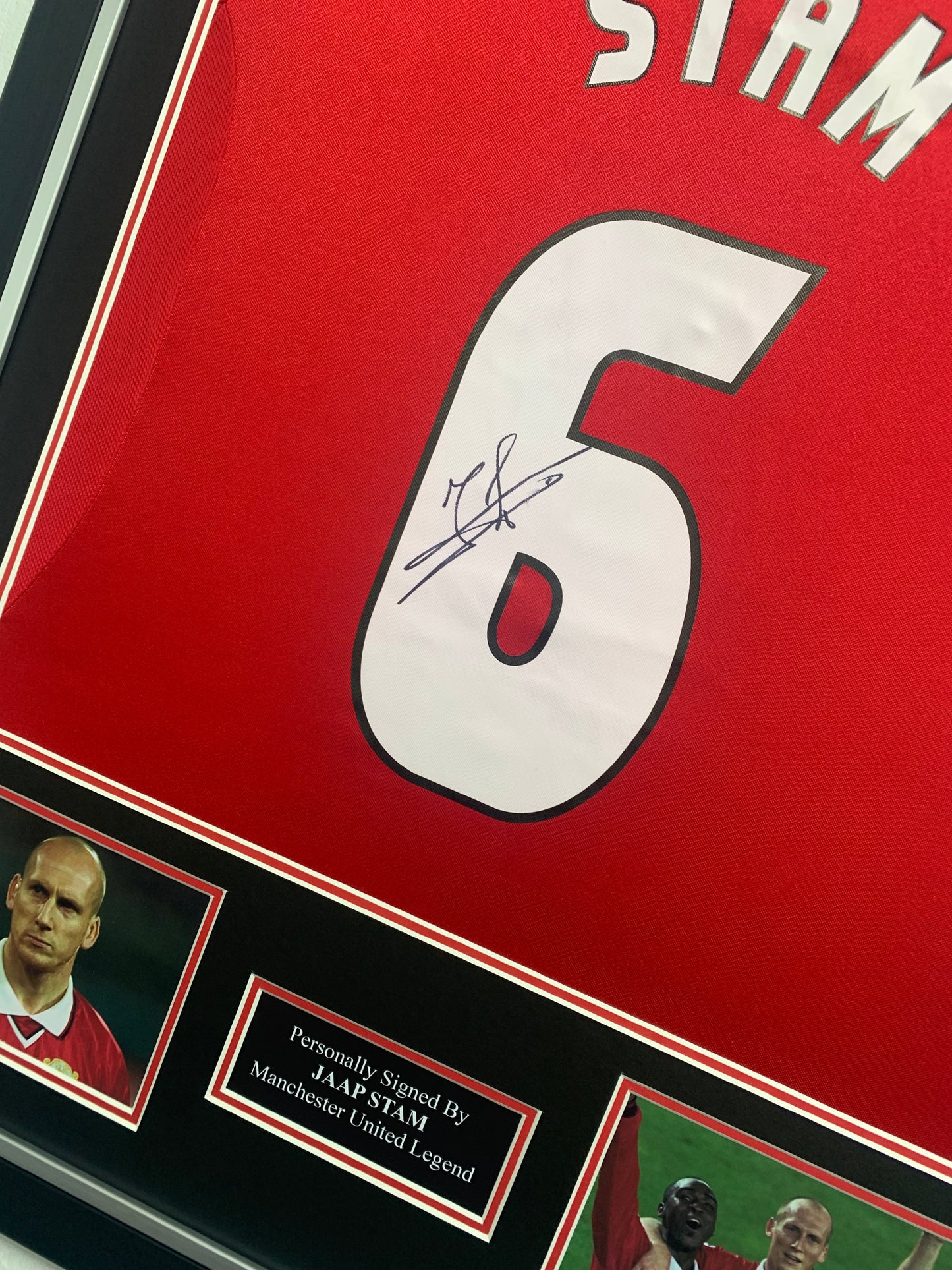 Jaap Stam signed framed 1999 champions league treble winning home Manchester United shirt
