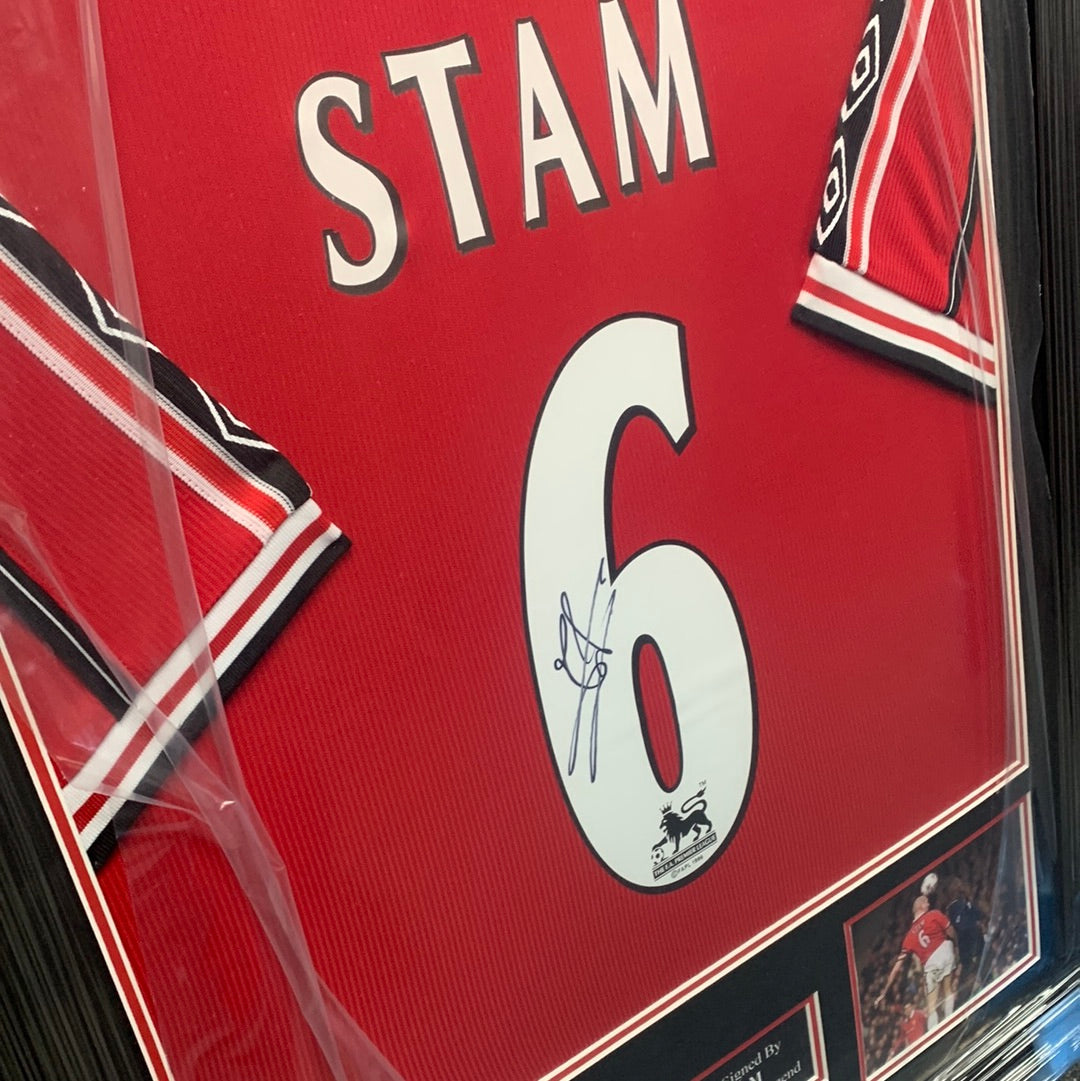 Jaap Stam signed framed 1999 treble winning home kit Manchester United shirt sleeves on show