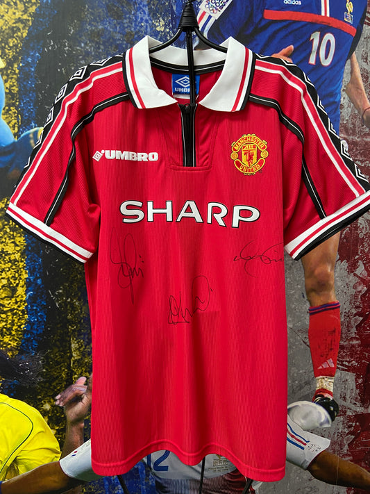 Manchester United 1999 treble winning red home shirt signed by multiple players