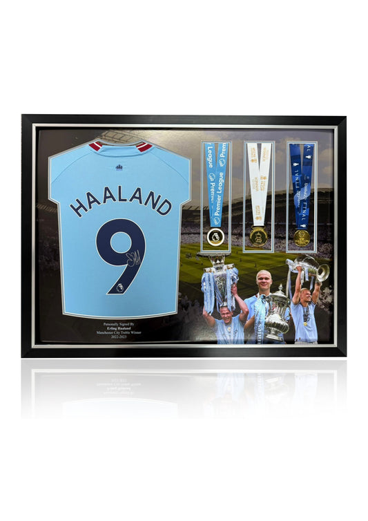 Erling Haaland framed deluxe montage signed Manchester City treble winning shirt and medals